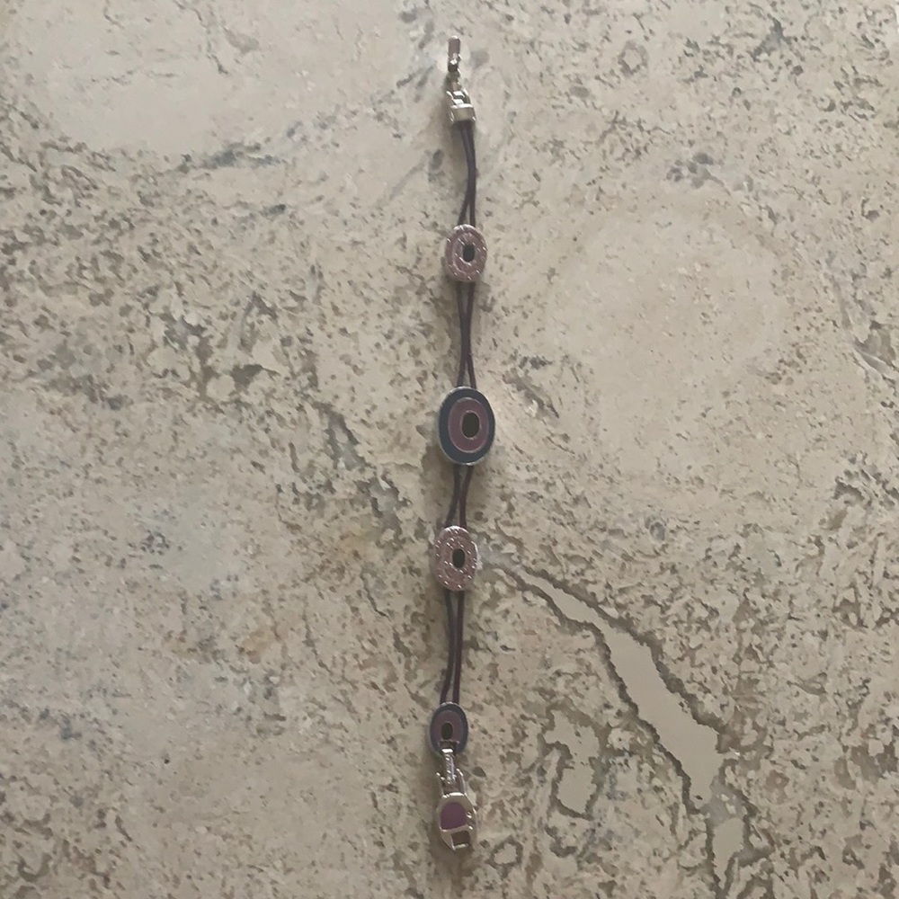 SWAROVSKI string bracelet w/purple crystals 7 1/4”